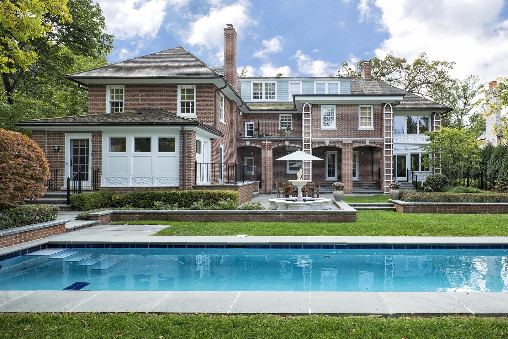 15 Old Green Bay Road Winnetka, IL 60093 - Photo 35 of 60 a front view of a house with swimming pool having outdoor seating