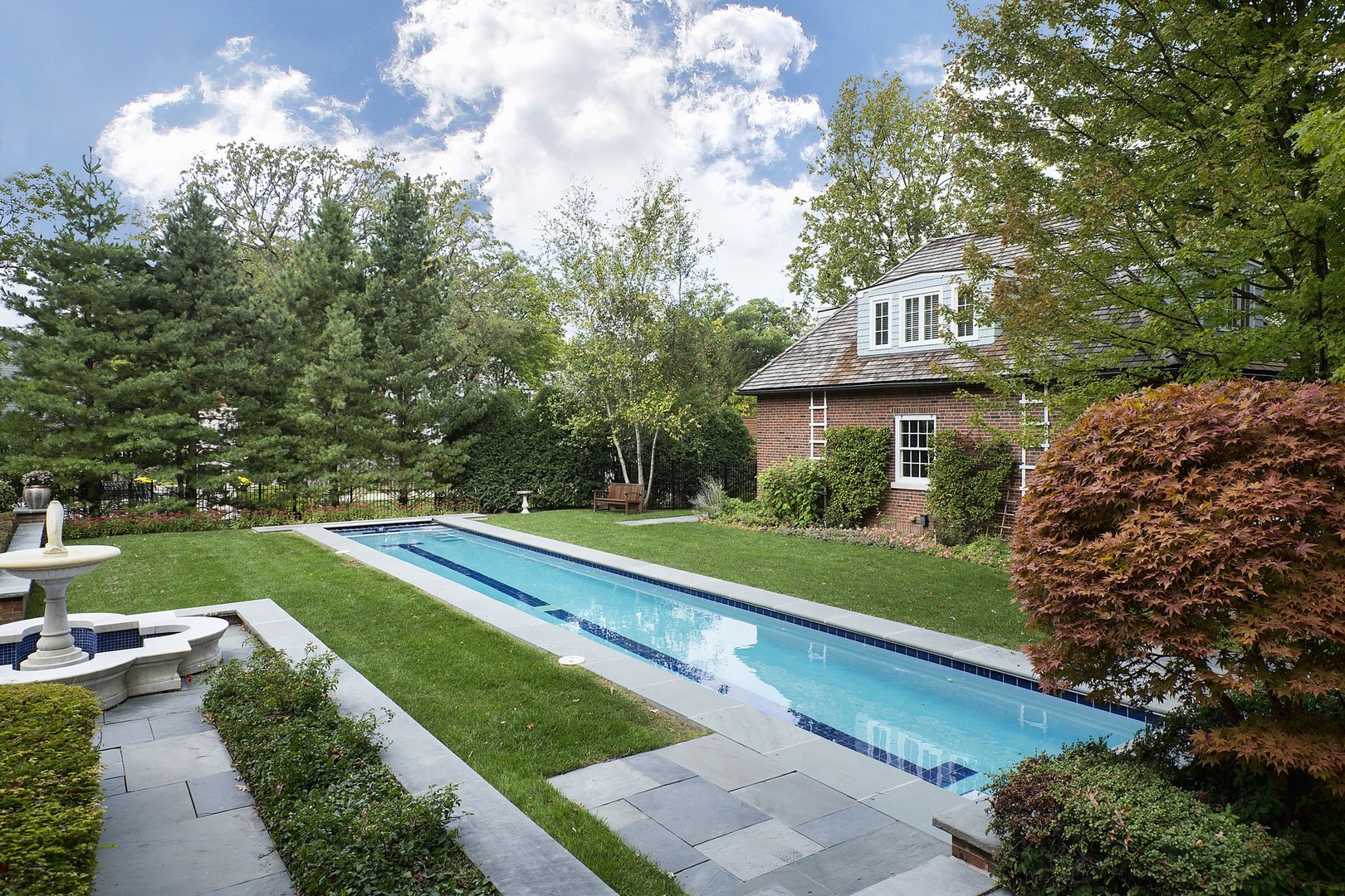 15 Old Green Bay Road Winnetka, IL 60093 - Photo 38 of 60 a view of a house with a yard potted plants and a large tree