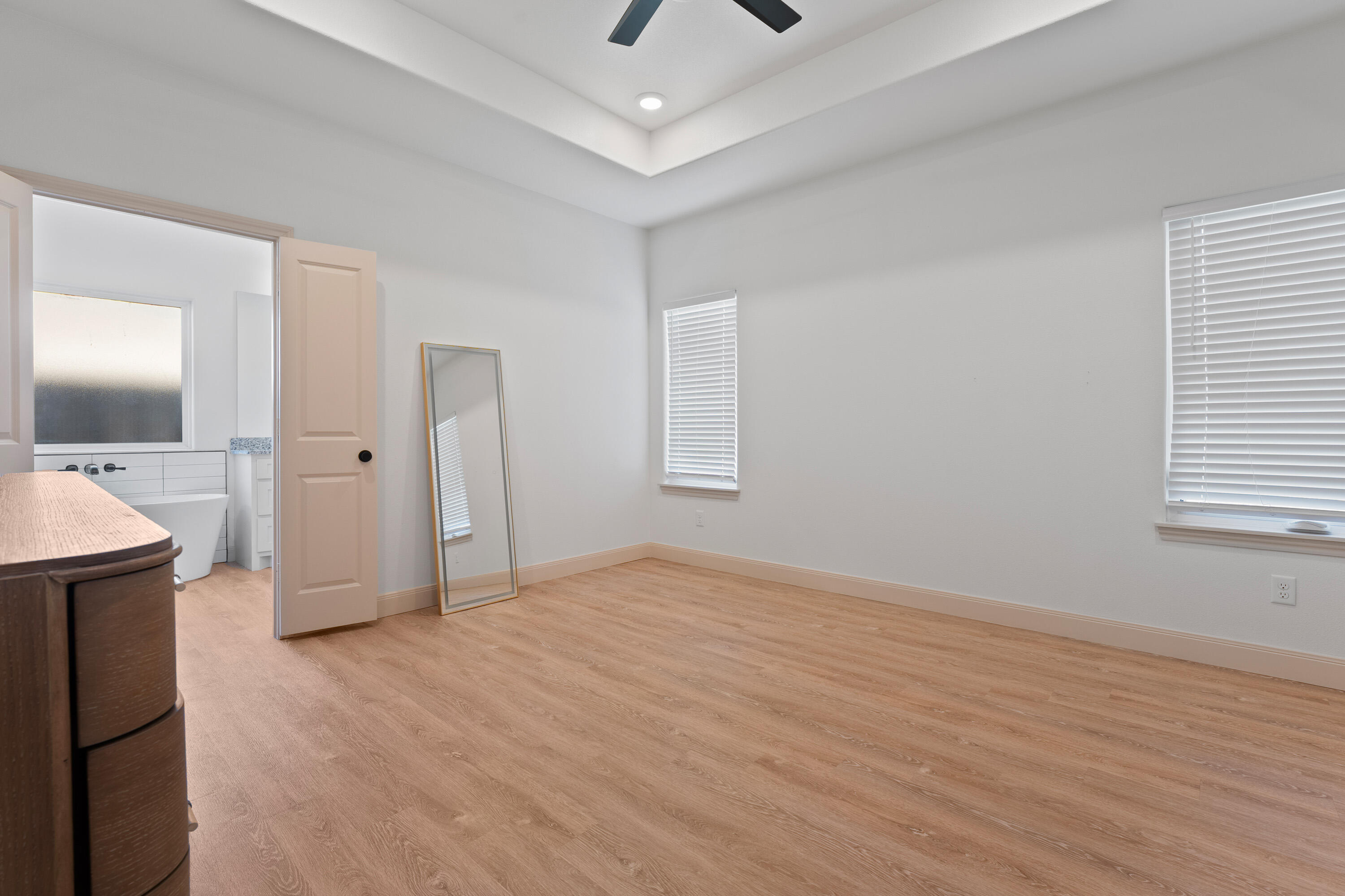 5516 120th Street Lubbock, TX 79424 - Photo 16 of 34 wooden floor in an empty room with a window