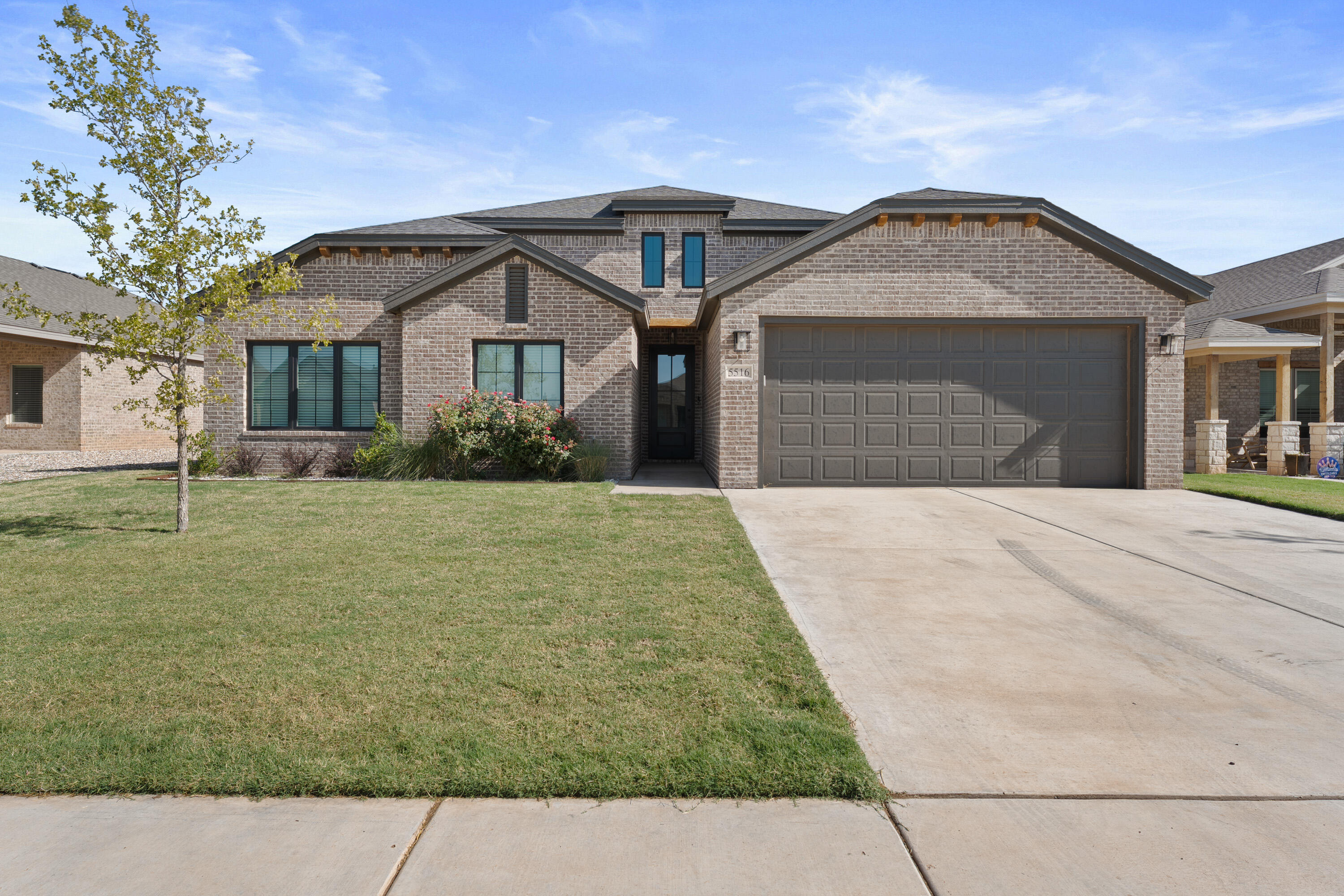 5516 120th Street Lubbock, TX 79424 - Photo 2 of 30 a front view of a house with a yard