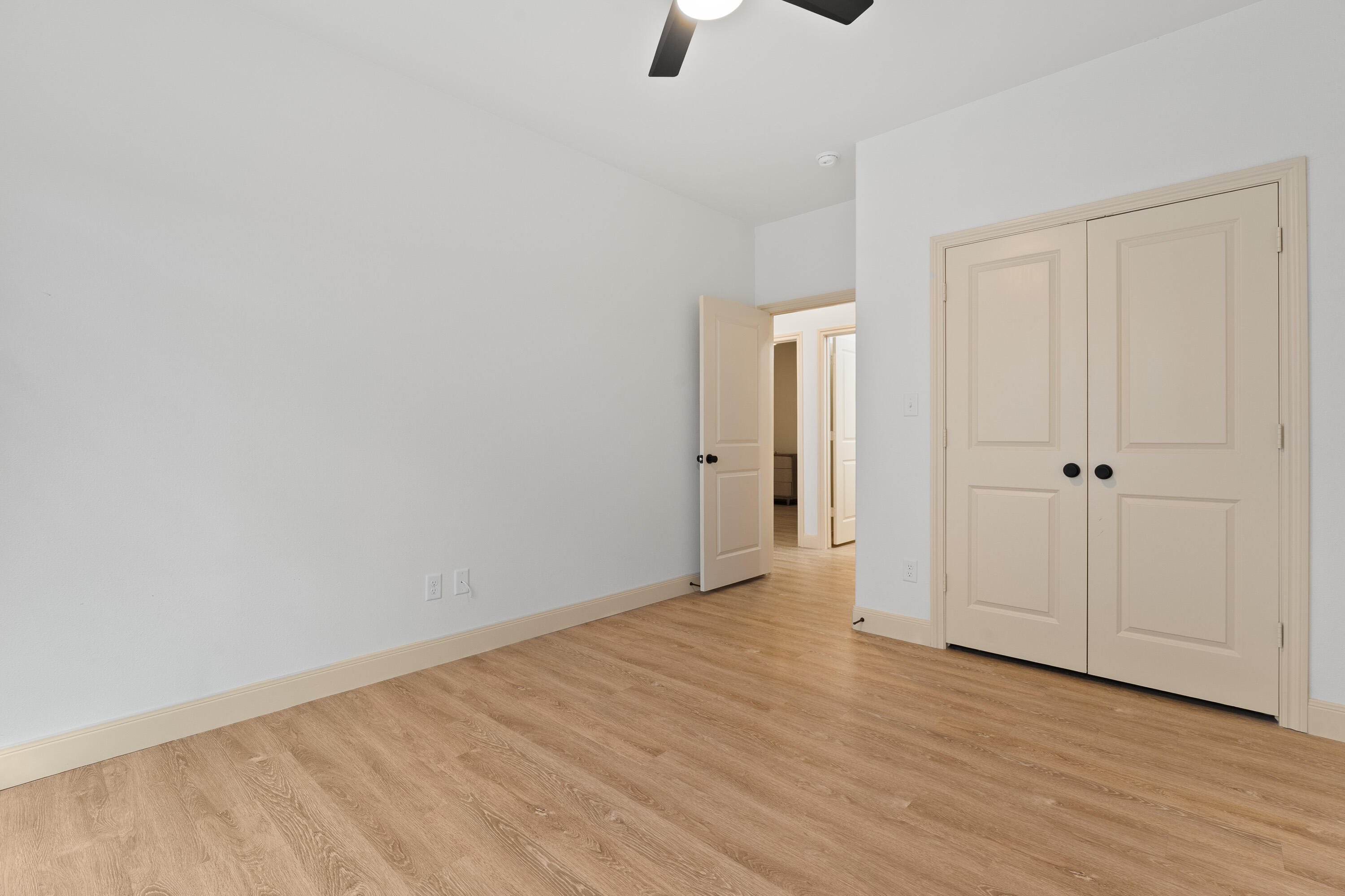 5516 120th Street Lubbock, TX 79424 - Photo 21 of 30 a view of an empty room with wooden floor