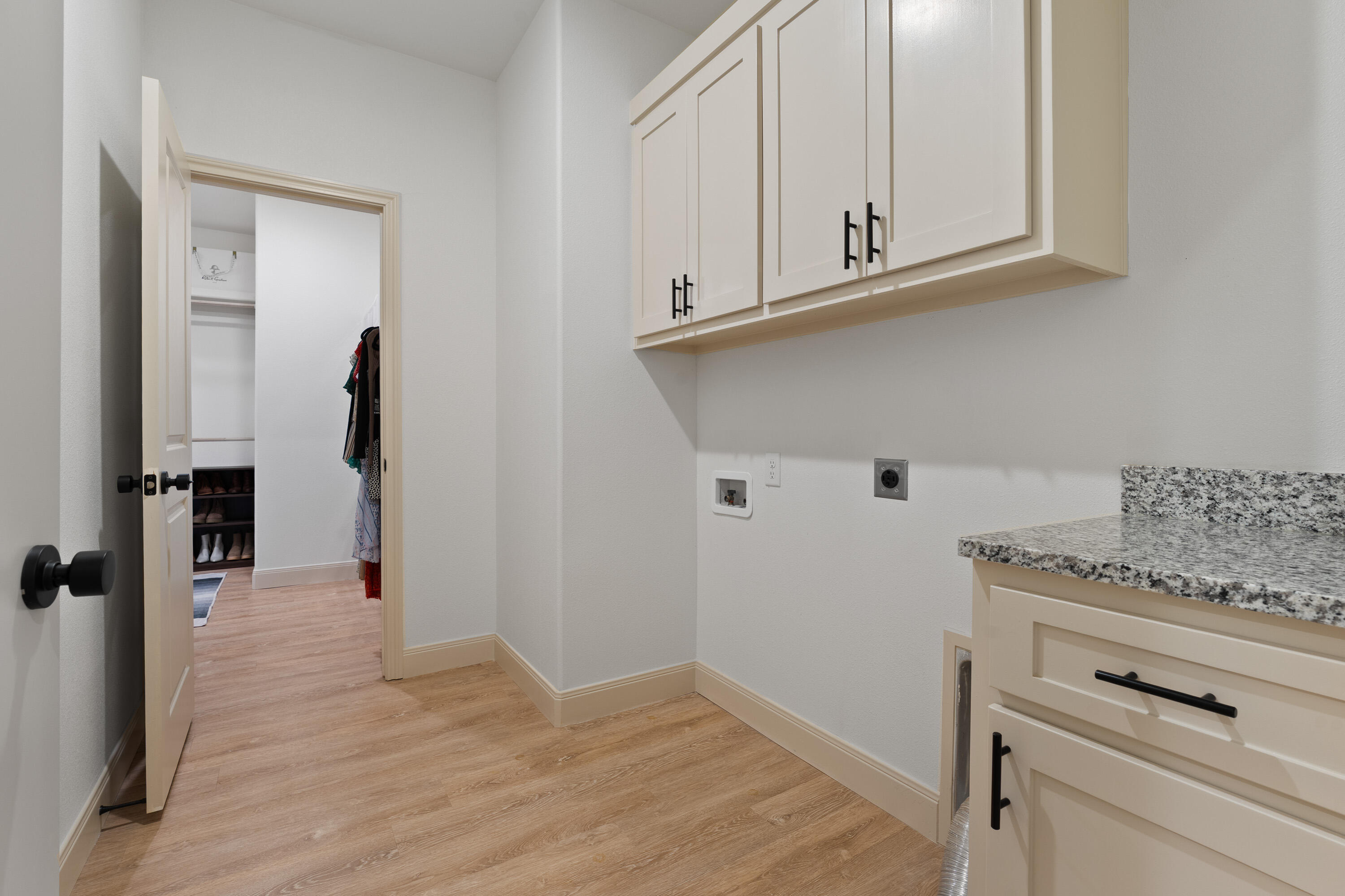5516 120th Street Lubbock, TX 79424 - Photo 27 of 30 a view of cabinets and wooden floor