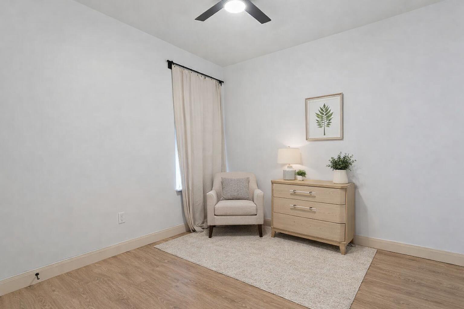 5516 120th Street Lubbock, TX 79424 - Photo 29 of 34 a living room with furniture and a baby crib