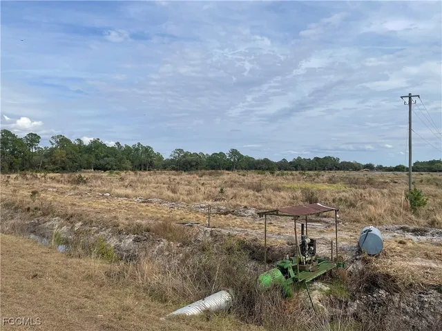 a view of a lake with houses in the back