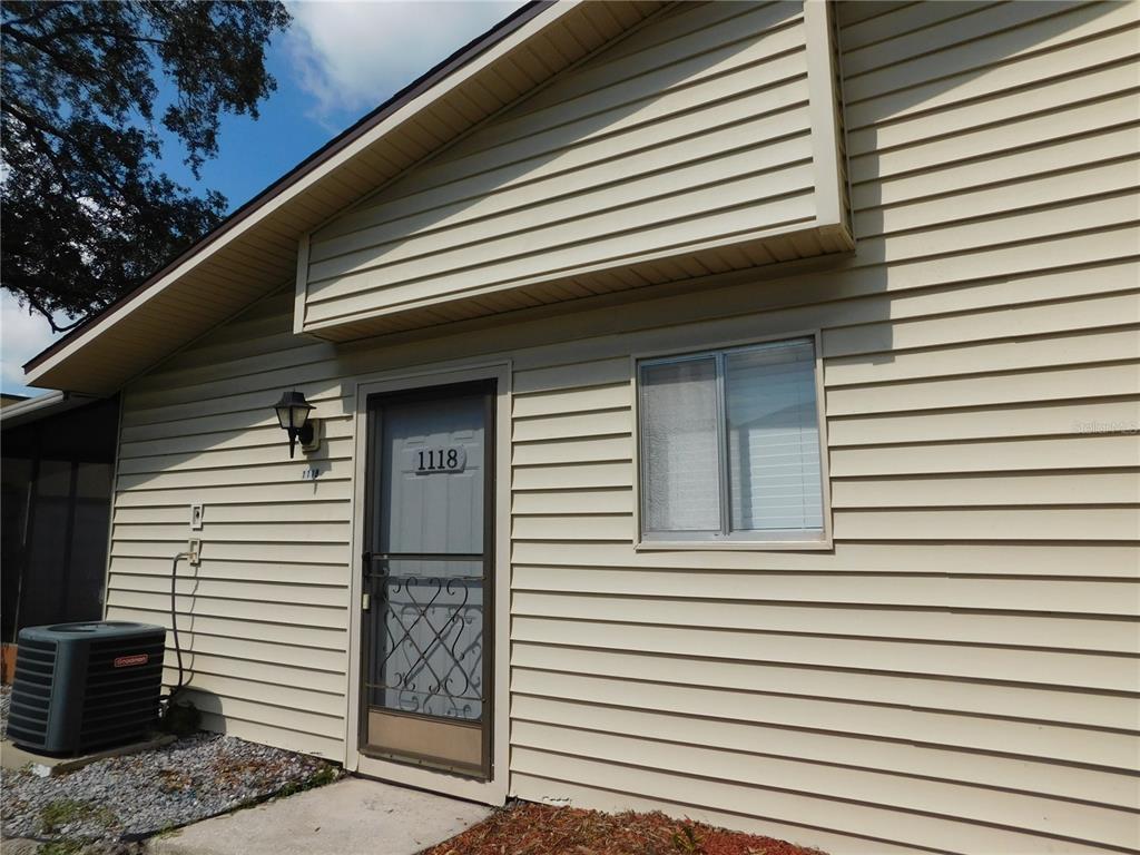 1118 Spring Meadow Drive, Unit 1118 Kissimmee, FL 34741 - Photo 1 of 1 a view of a windows and brick walls