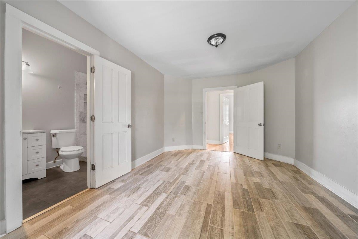 196 North McNeil Street Memphis, TN 38112 - Photo 17 of 31 a view of a room with wooden floor and bathroom view