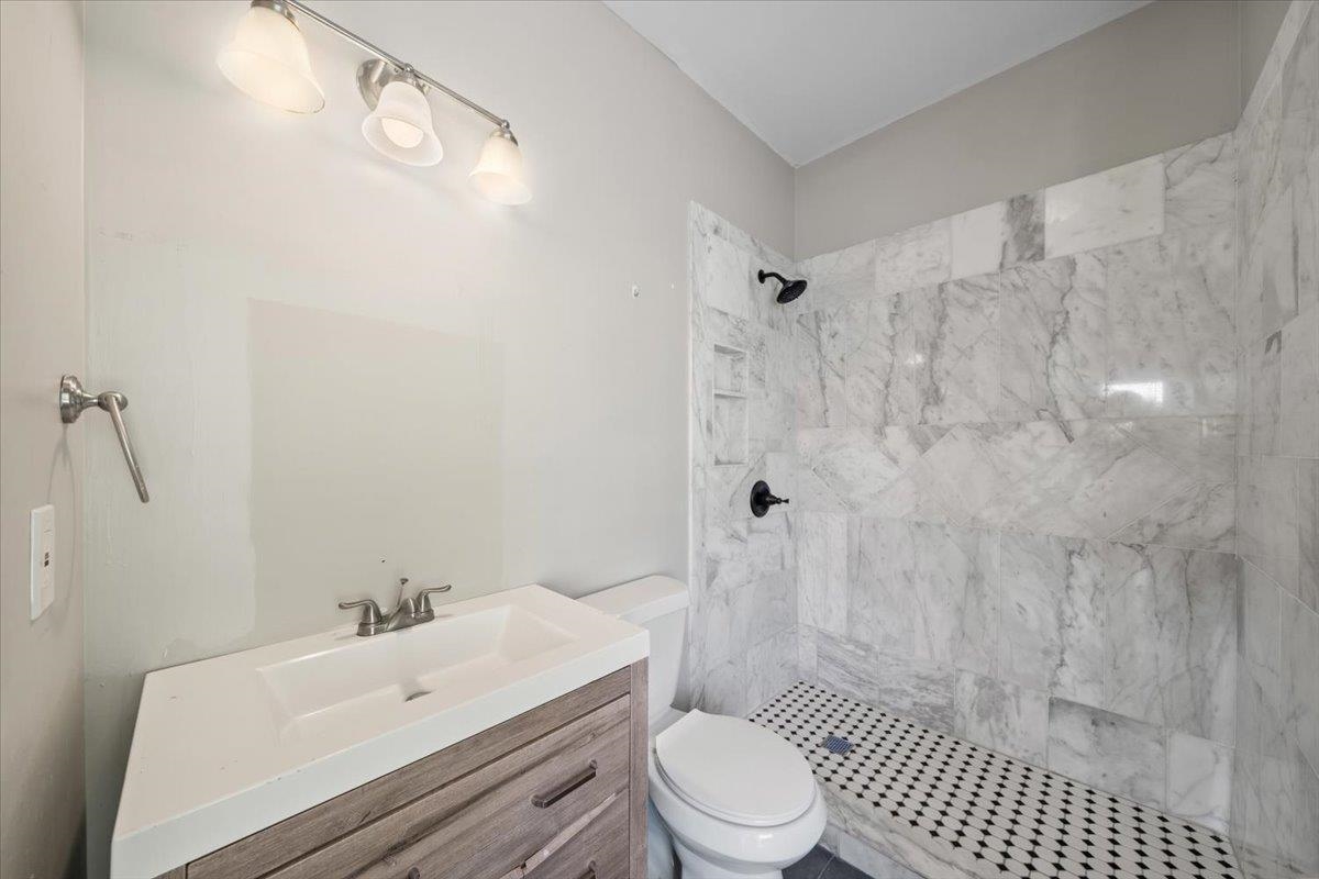 196 North McNeil Street Memphis, TN 38112 - Photo 20 of 31 a bathroom with a sink toilet and shower