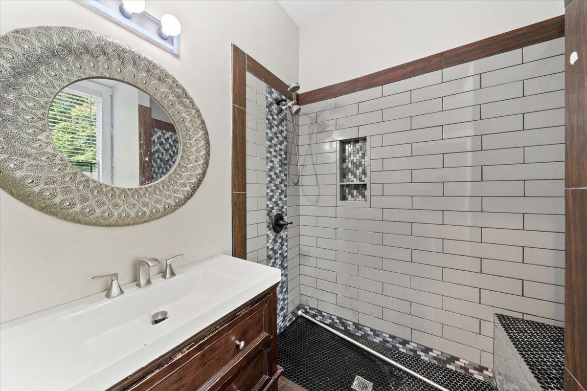 196 North McNeil Street Memphis, TN 38112 - Photo 27 of 31 a bathroom with a sink and a mirror