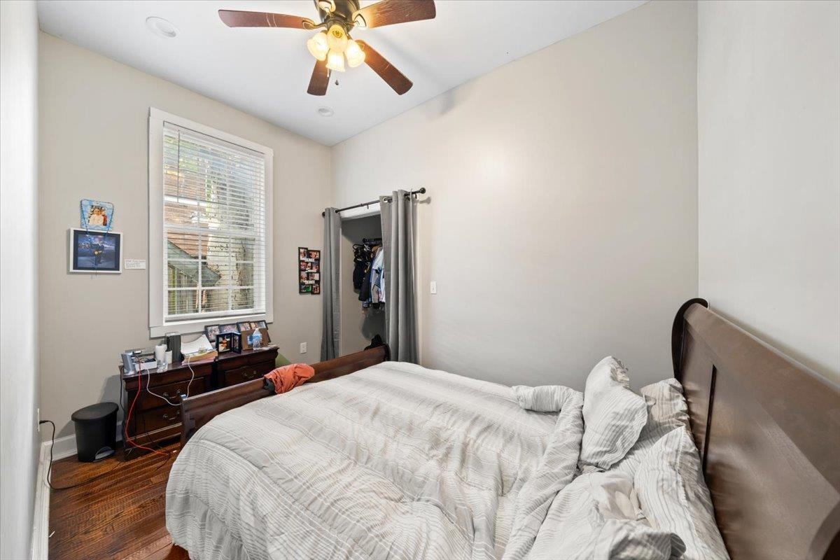 196 North McNeil Street Memphis, TN 38112 - Photo 28 of 31 a bedroom with a bed and a chandelier