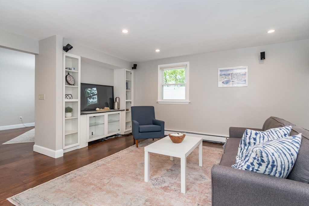 14 Wedgewood Road Natick, MA 01760 - Photo 15 of 28 a living room with furniture and a flat screen tv