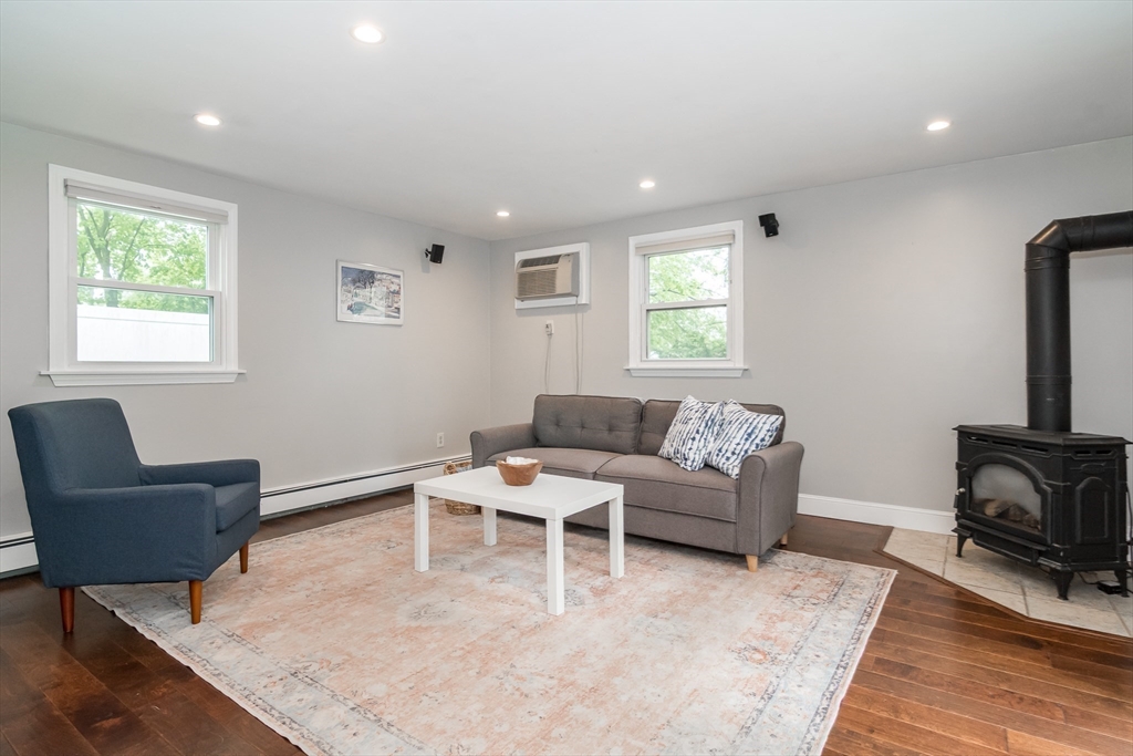 14 Wedgewood Road Natick, MA 01760 - Photo 16 of 28 a living room with furniture and a flat screen tv