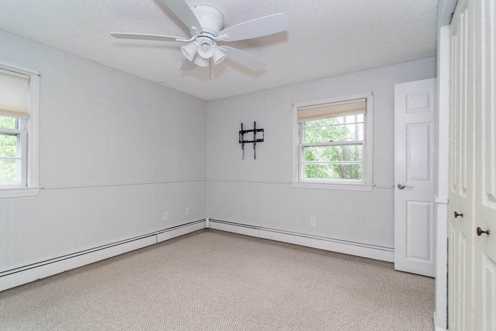 14 Wedgewood Road Natick, MA 01760 - Photo 19 of 28 an empty room with a window and a fan