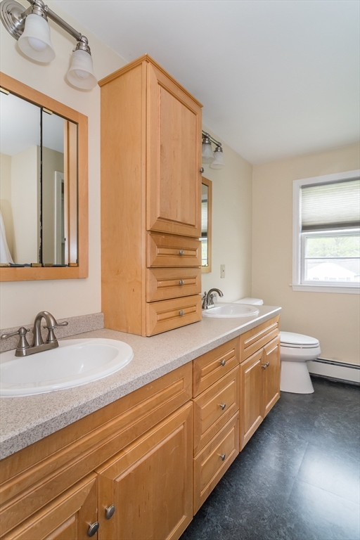 14 Wedgewood Road Natick, MA 01760 - Photo 20 of 28 a bathroom with a double vanity sink and a mirror