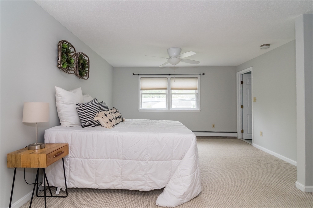 14 Wedgewood Road Natick, MA 01760 - Photo 23 of 28 a bedroom with a bed and a window
