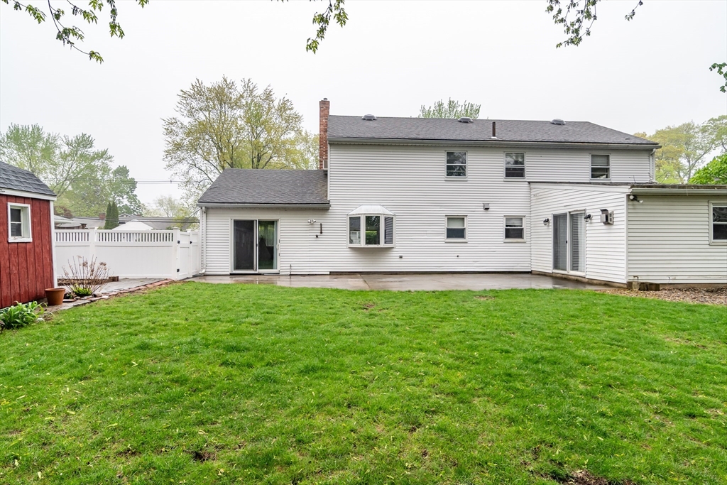 14 Wedgewood Road Natick, MA 01760 - Photo 26 of 28 a view of a house with backyard and a garden