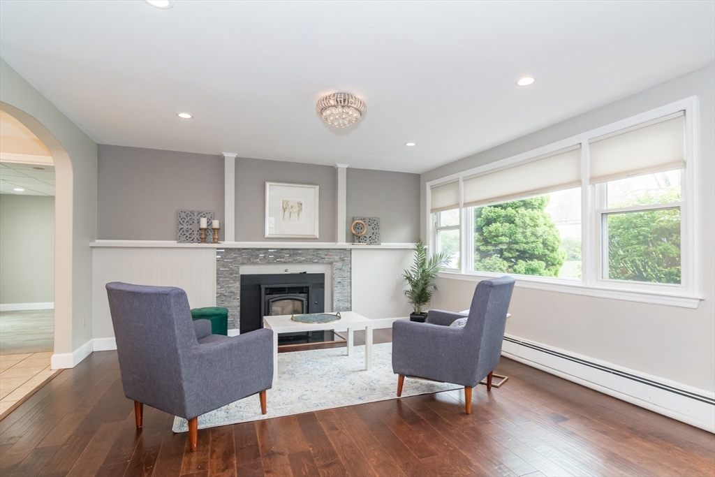 14 Wedgewood Road Natick, MA 01760 - Photo 3 of 28 a living room with furniture and a fireplace