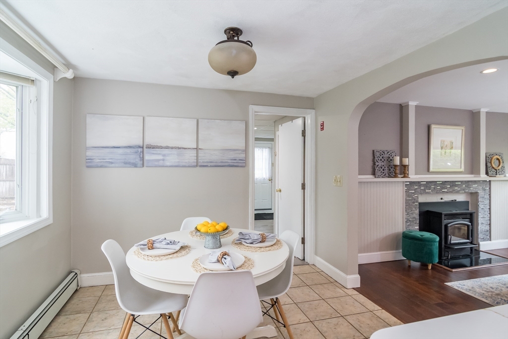 14 Wedgewood Road Natick, MA 01760 - Photo 5 of 28 a dining room with furniture and fireplace