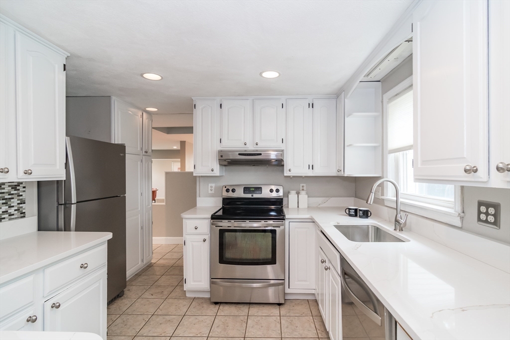 14 Wedgewood Road Natick, MA 01760 - Photo 7 of 28 a kitchen with a sink white stove and refrigerator