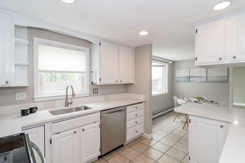 14 Wedgewood Road Natick, MA 01760 - Photo 8 of 28 a kitchen that has a sink and a stove in it
