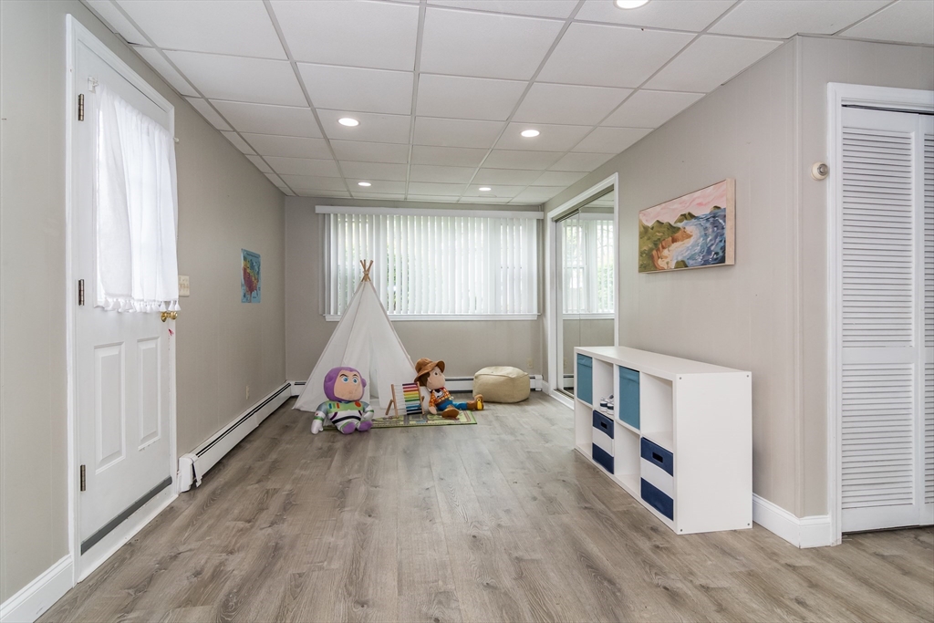 14 Wedgewood Road Natick, MA 01760 - Photo 9 of 28 a living room with furniture and a wooden floor