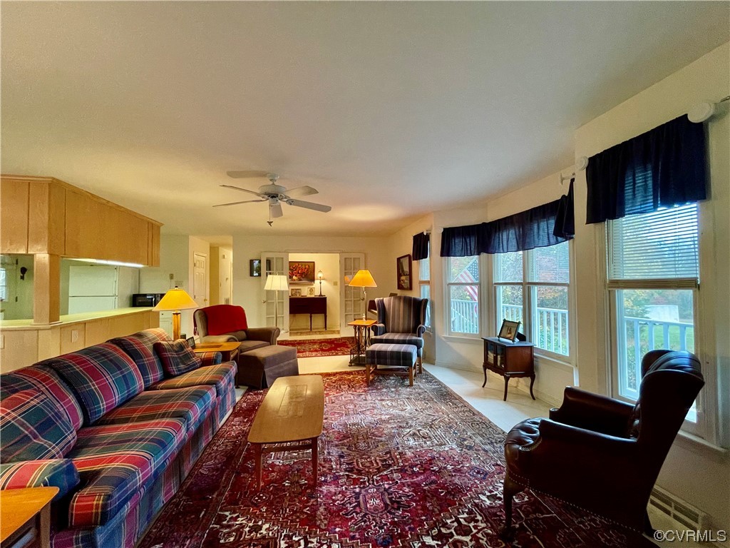 1751 Evans Mill Road Dillwyn, VA 23936 - Photo 9 of 50 a living room with furniture ceiling fan and a rug
