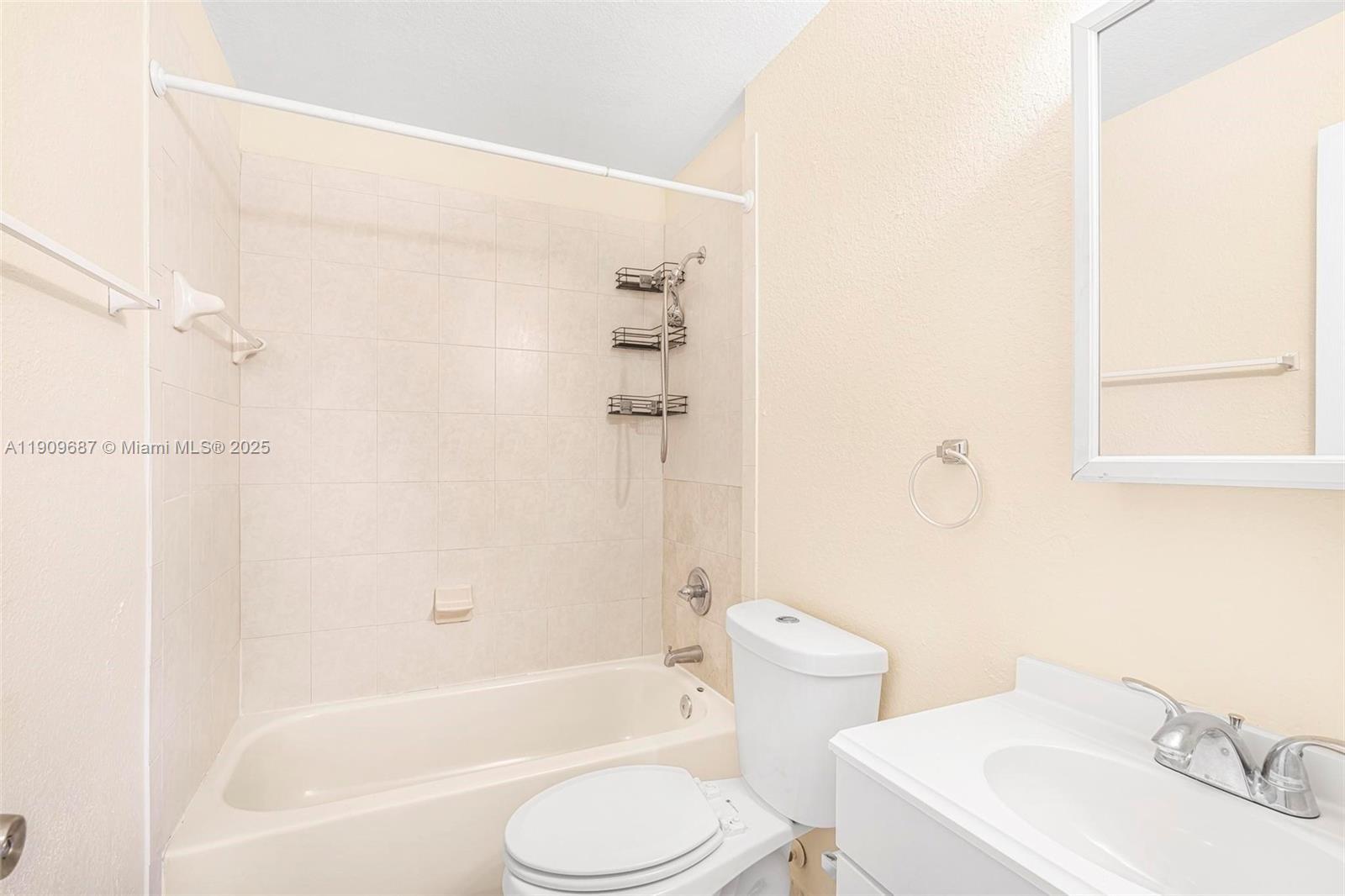 2261 Northwest 136th Terrace, Unit 2261 Opa-Locka, FL 33054 - Photo 13 of 19 a bathroom with a sink toilet and shower