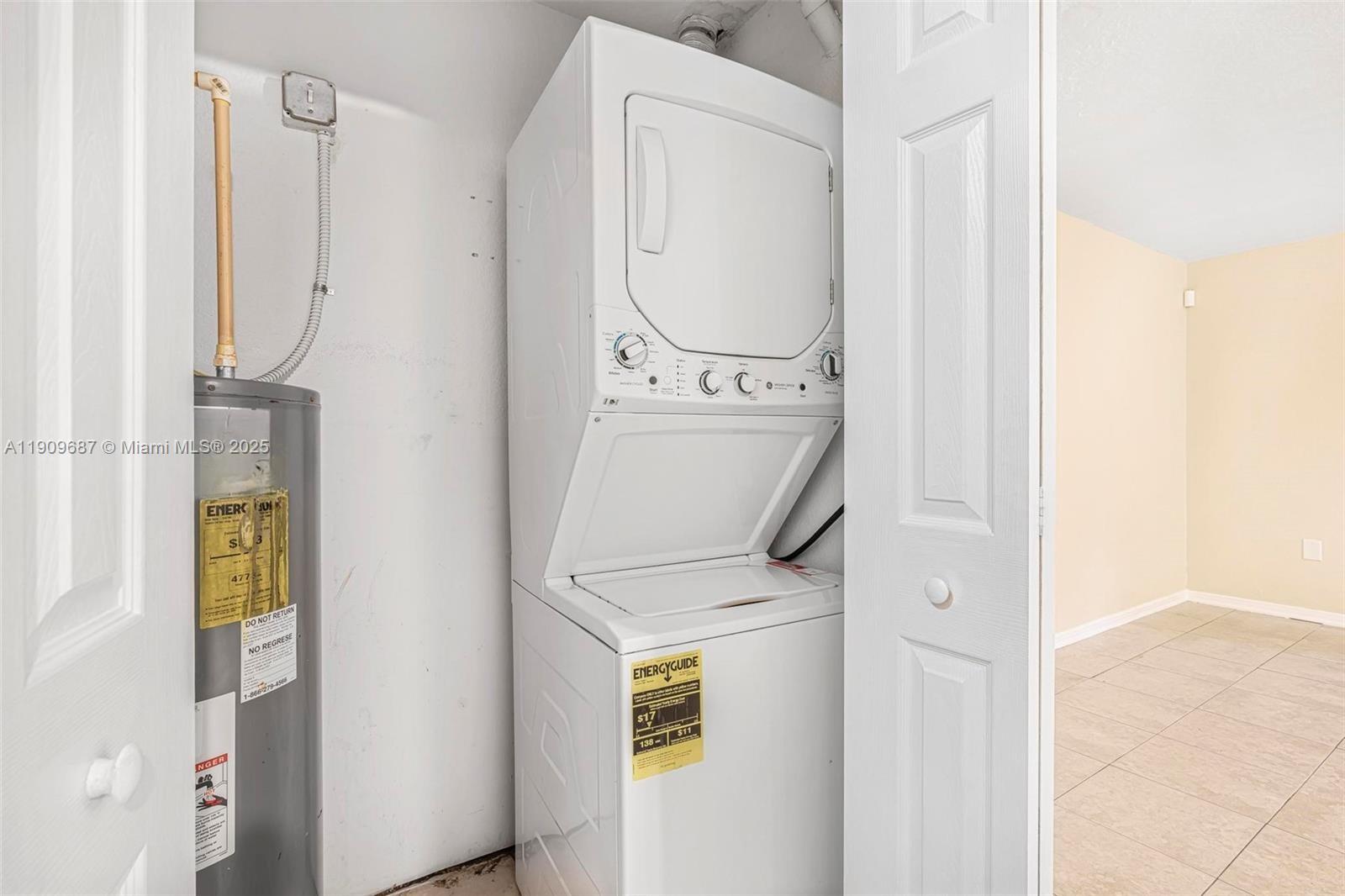 2261 Northwest 136th Terrace, Unit 2261 Opa-Locka, FL 33054 - Photo 17 of 19 a utility room with dryer and washer