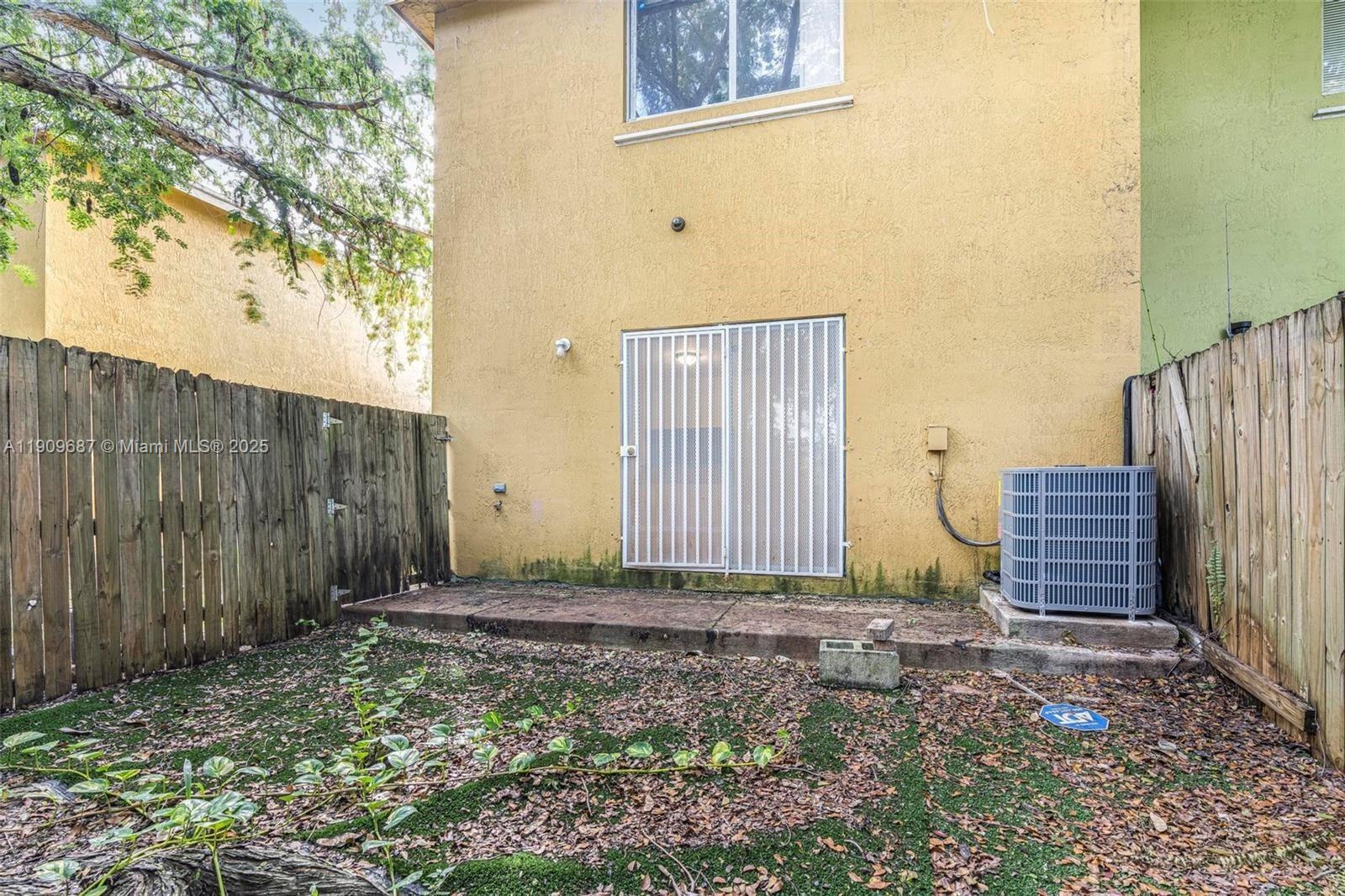 2261 Northwest 136th Terrace, Unit 2261 Opa-Locka, FL 33054 - Photo 19 of 19 a view of a backyard with pathway