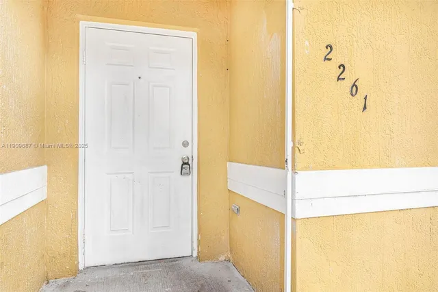 a view of a hallway with a door