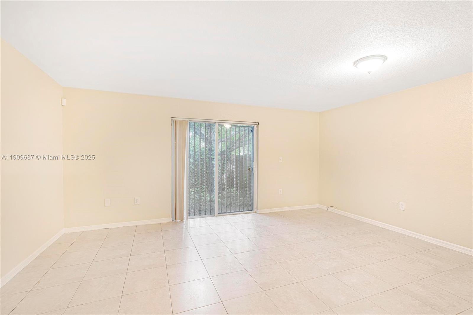 2261 Northwest 136th Terrace, Unit 2261 Opa-Locka, FL 33054 - Photo 4 of 19 a view of an empty room