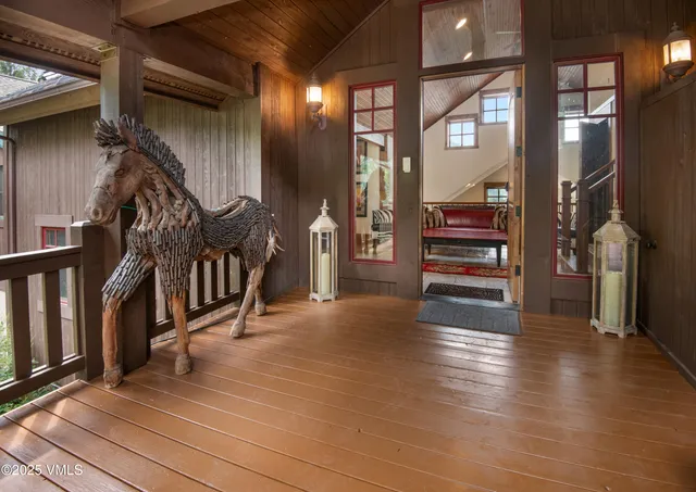 a view of an entryway with wooden floor
