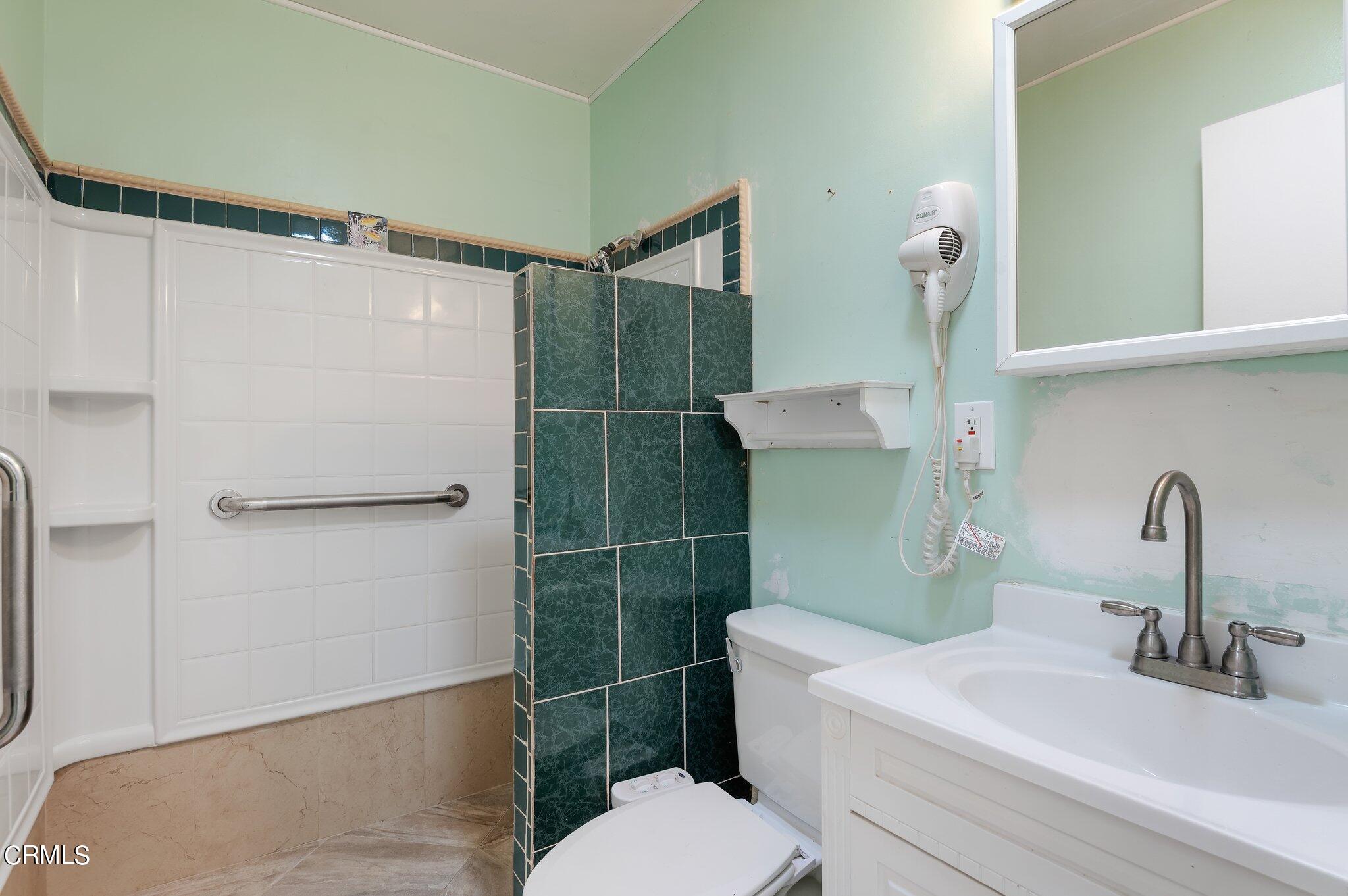 4810 Del Oro Place Oxnard, CA 93033 - Photo 14 of 21 a bathroom with a sink toilet and shower