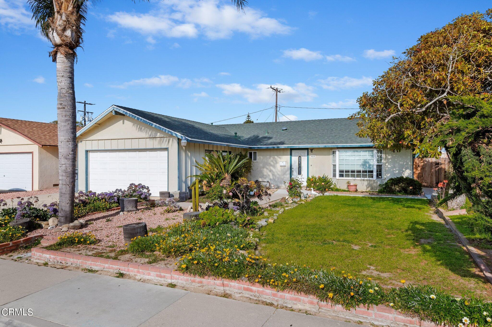 4810 Del Oro Place Oxnard, CA 93033 - Photo 2 of 21 a front view of a house with garden