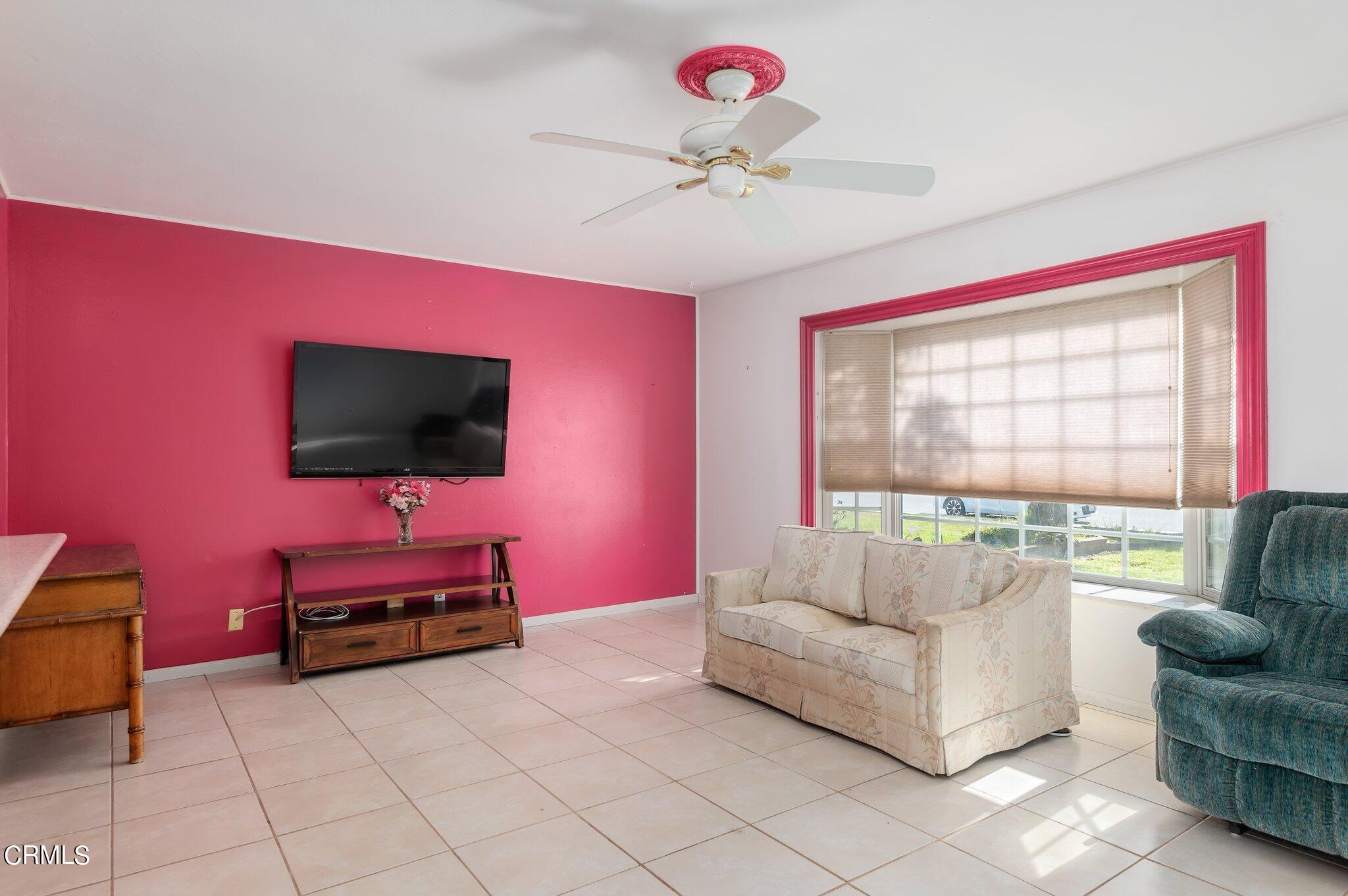 4810 Del Oro Place Oxnard, CA 93033 - Photo 5 of 21 a living room with furniture and a flat screen tv