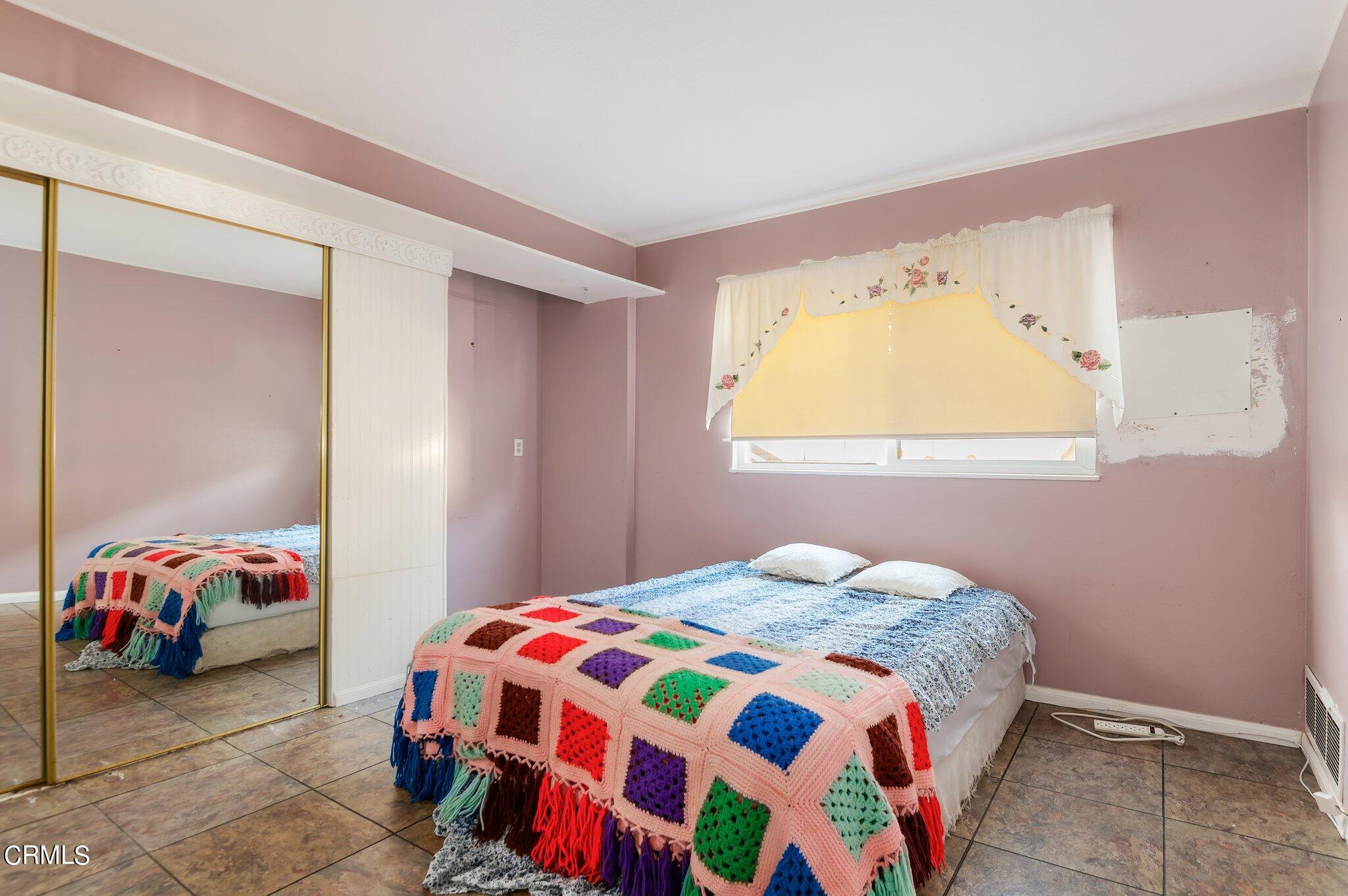 4810 Del Oro Place Oxnard, CA 93033 - Photo 10 of 21 a bedroom with a bed and a window