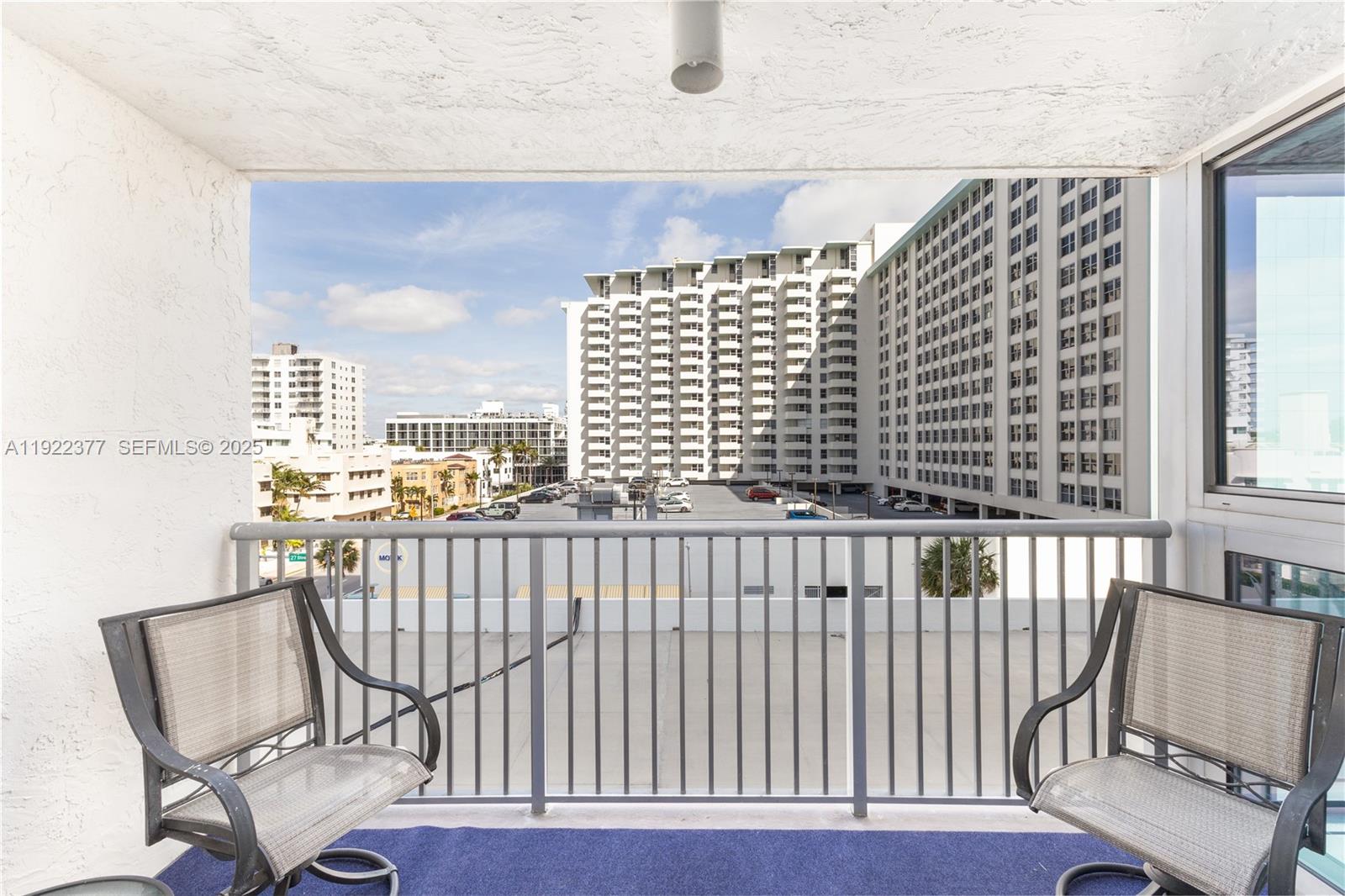 2655 Collins Avenue, Unit 603 Miami Beach, FL 33140 - Photo 15 of 66 a view of a balcony with chair