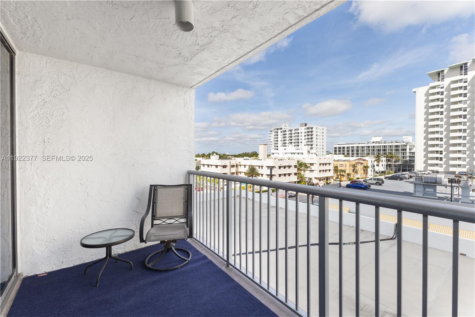 2655 Collins Avenue, Unit 603 Miami Beach, FL 33140 - Photo 16 of 66 a view of a balcony and chairs