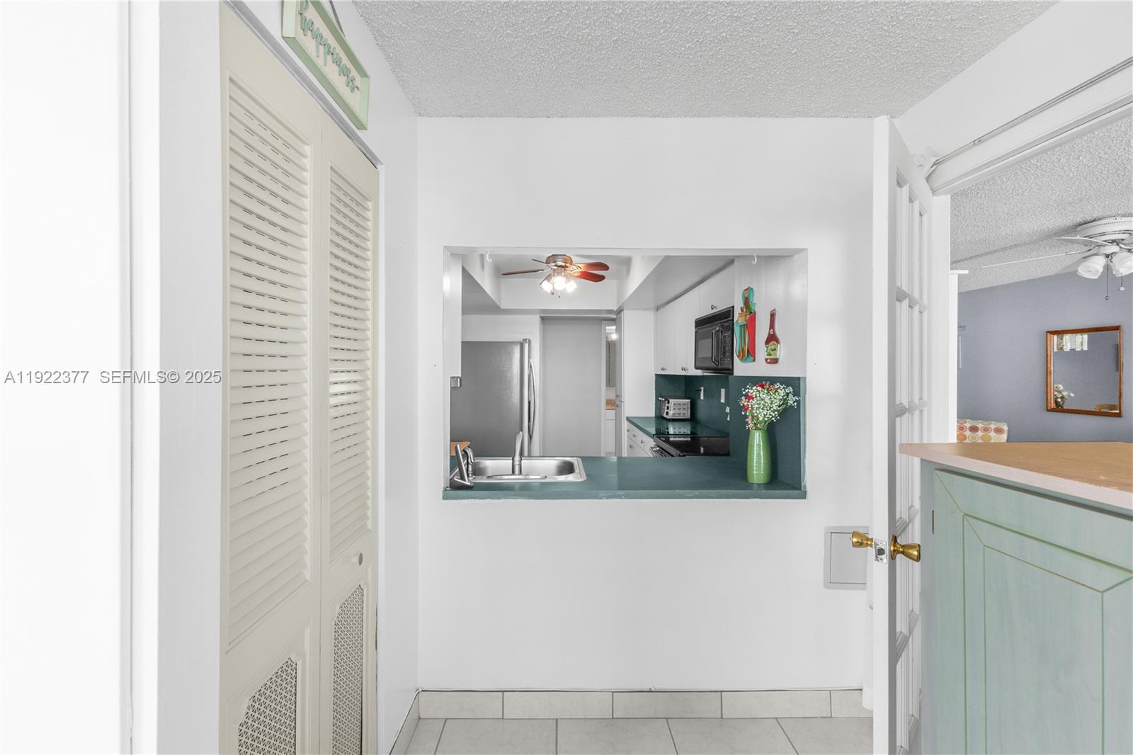 2655 Collins Avenue, Unit 603 Miami Beach, FL 33140 - Photo 29 of 66 a view of a living room and kitchen