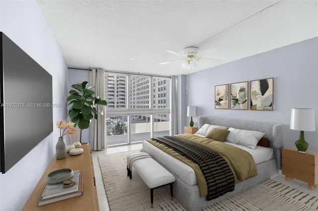 a living room with furniture and a floor to ceiling window