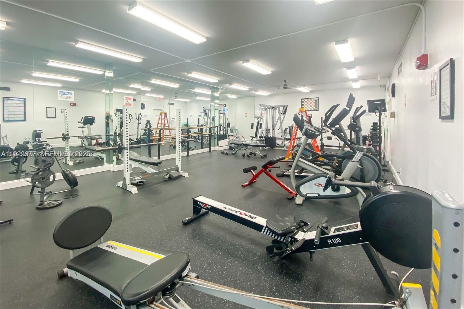 2655 Collins Avenue, Unit 603 Miami Beach, FL 33140 - Photo 53 of 66 a view of a room with gym equipment