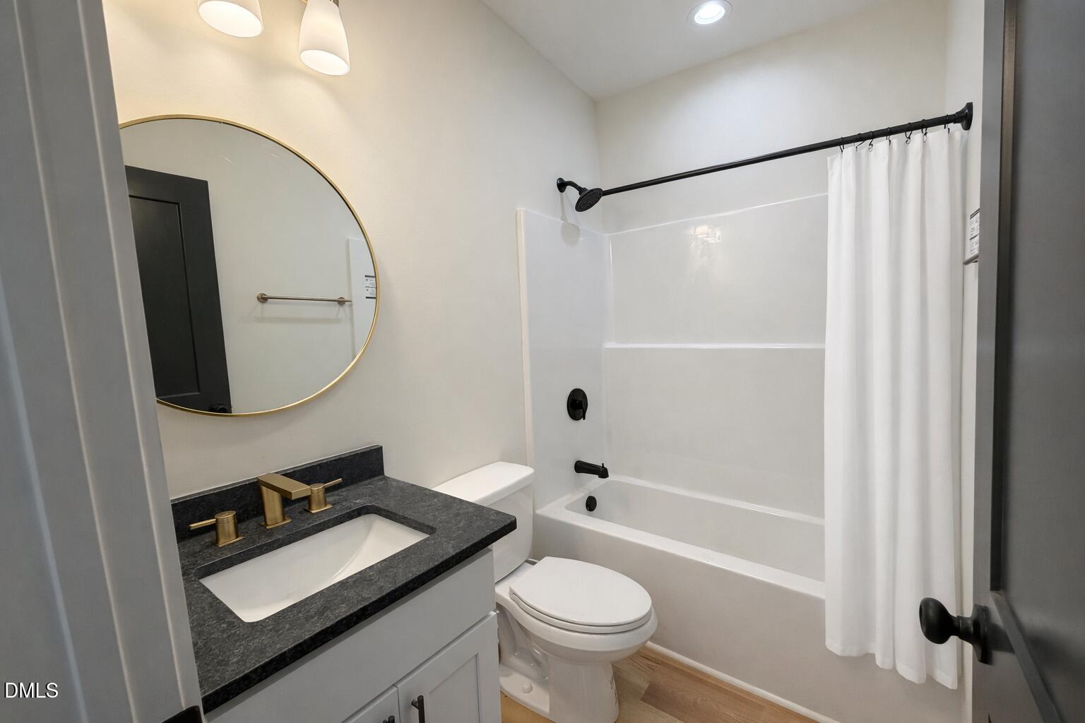 390 Park Springs Road Providence, NC 27315 - Photo 10 of 14 a bathroom with a sink toilet and shower