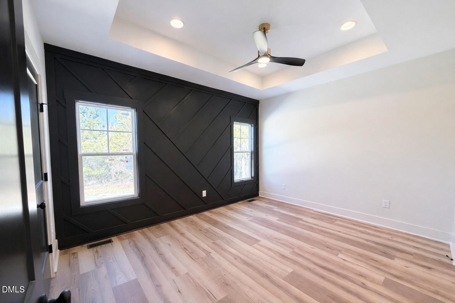 390 Park Springs Road Providence, NC 27315 - Photo 7 of 14 a view of an empty room with a window and wooden floor