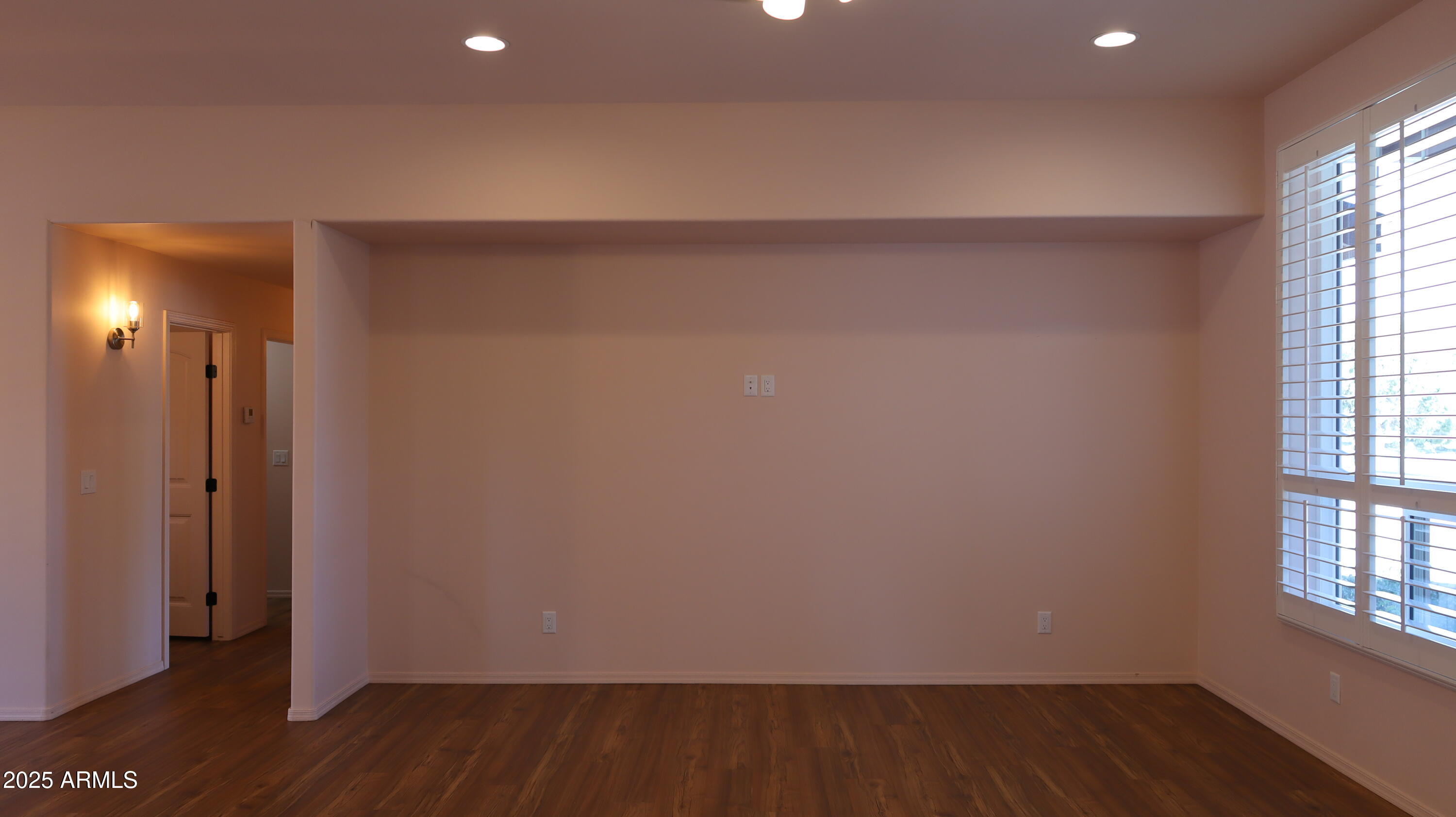 1701 West Dillon Way Payson, AZ 85541 - Photo 14 of 83 an empty room with wooden floor and windows