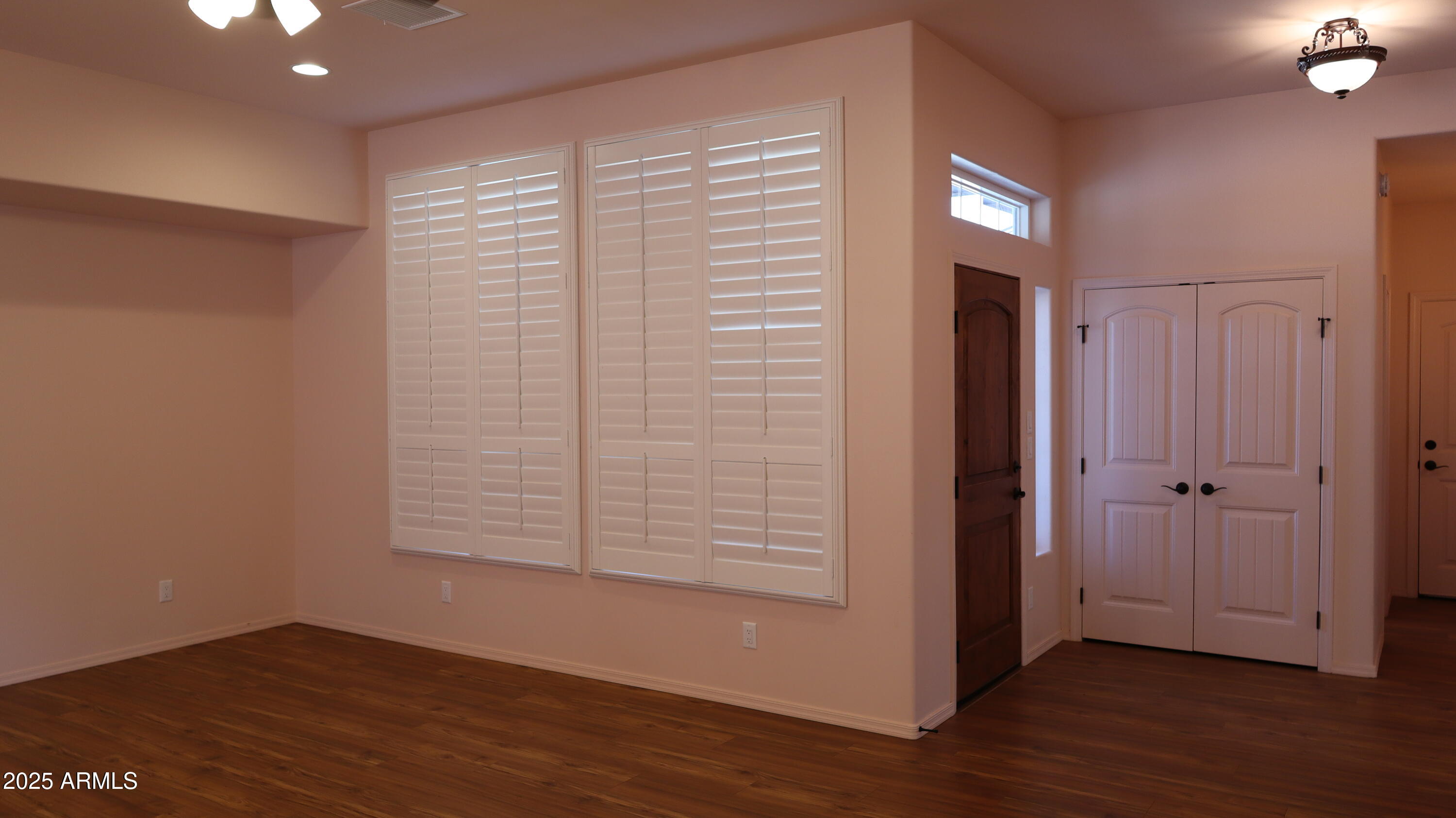 1701 West Dillon Way Payson, AZ 85541 - Photo 15 of 83 an empty room with wooden floor and windows