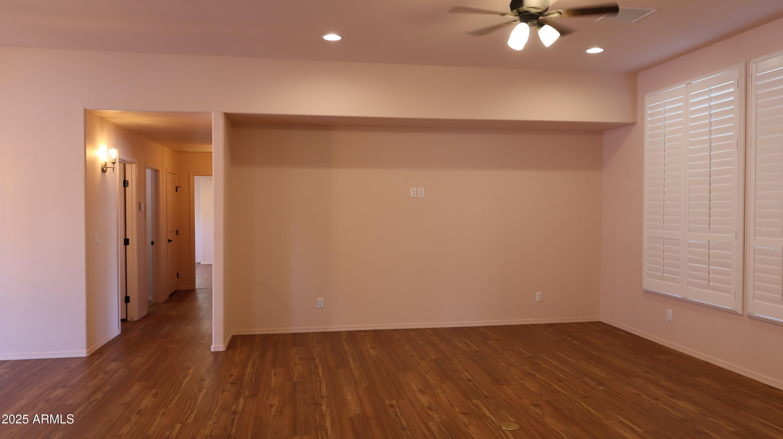 1701 West Dillon Way Payson, AZ 85541 - Photo 16 of 83 an empty room with wooden floor and chandelier fan
