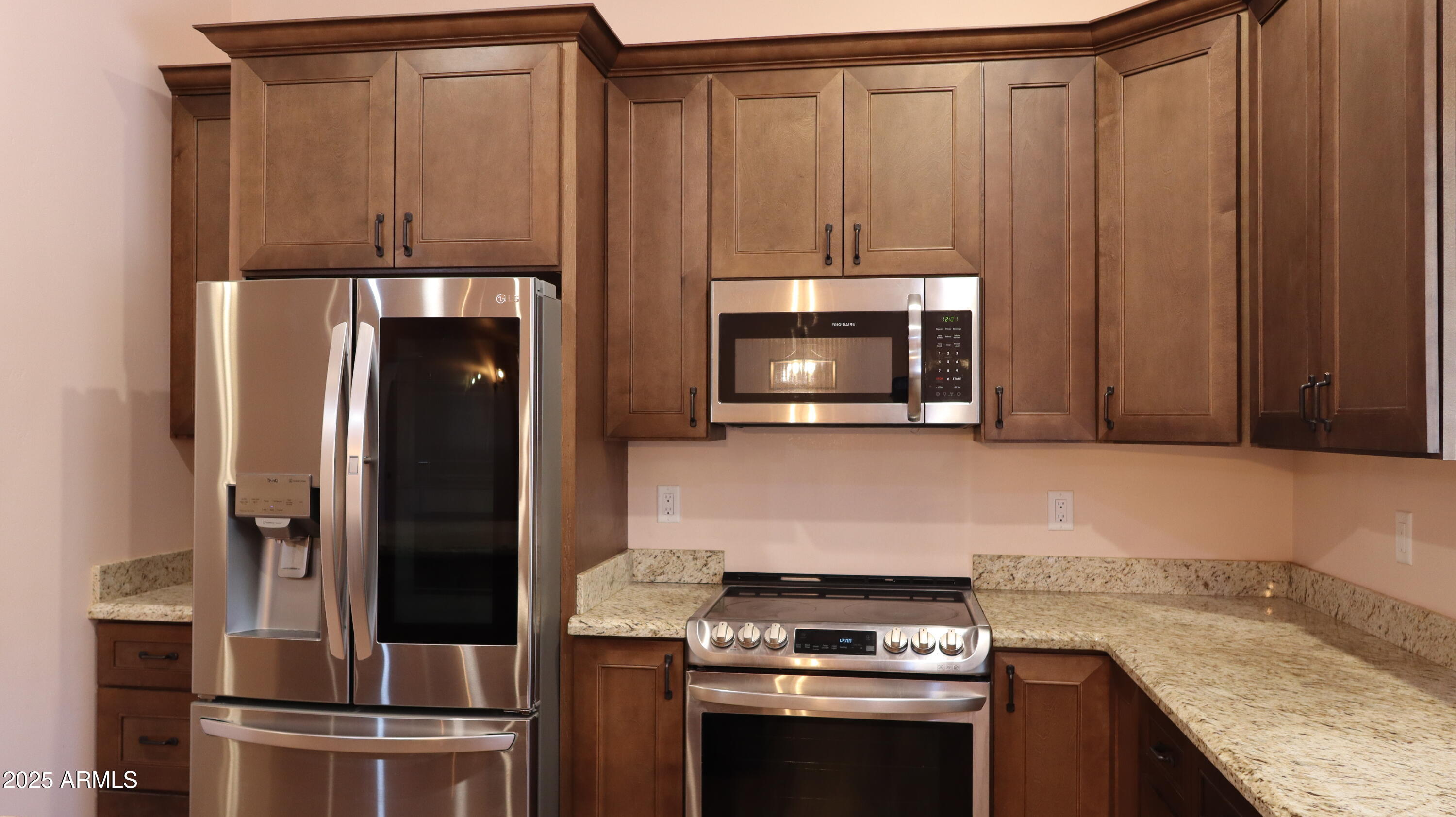 1701 West Dillon Way Payson, AZ 85541 - Photo 25 of 83 a kitchen with granite countertop wood cabinets and stainless steel appliances