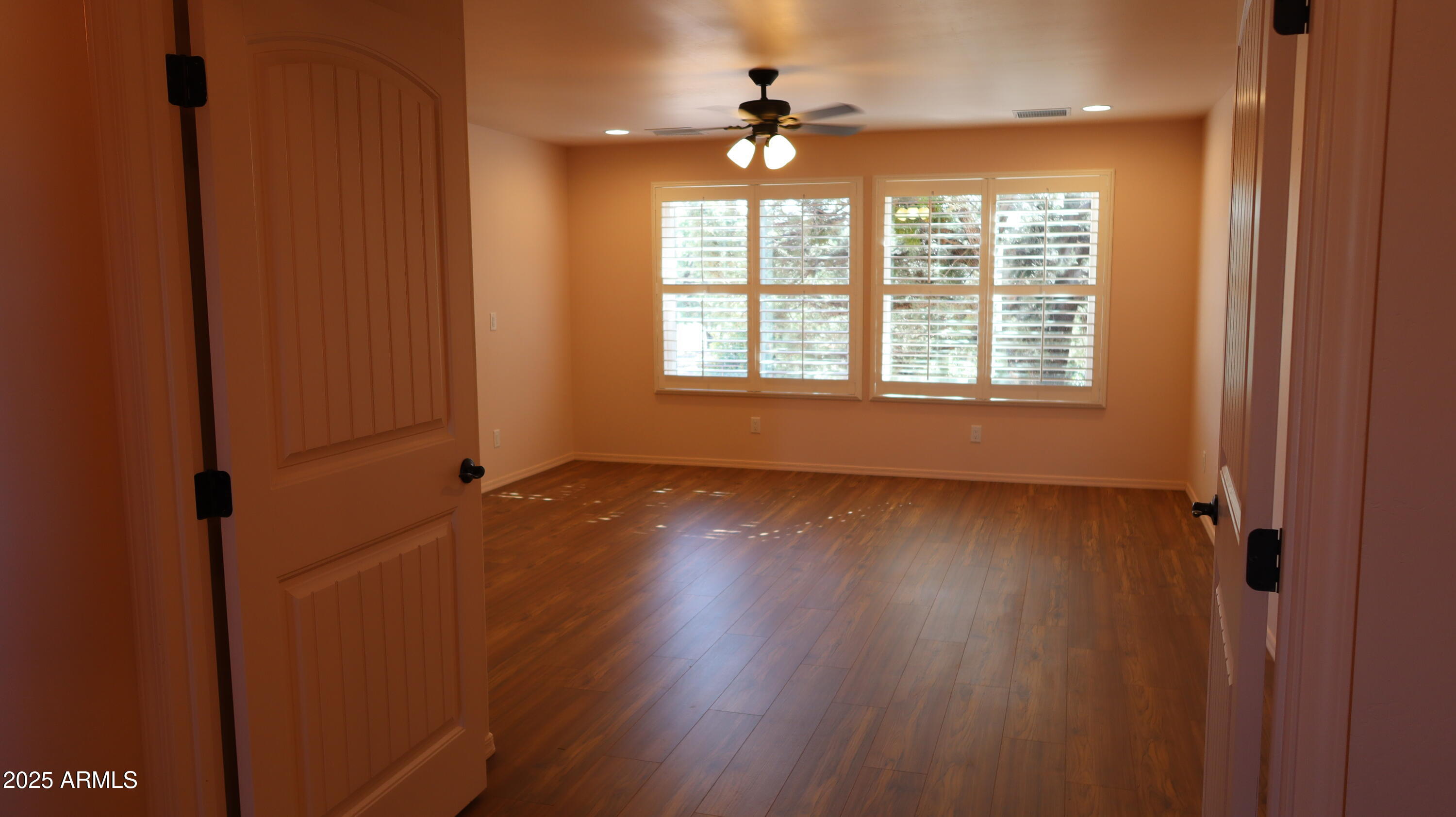 1701 West Dillon Way Payson, AZ 85541 - Photo 30 of 83 a view of an empty room with a window and wooden floor