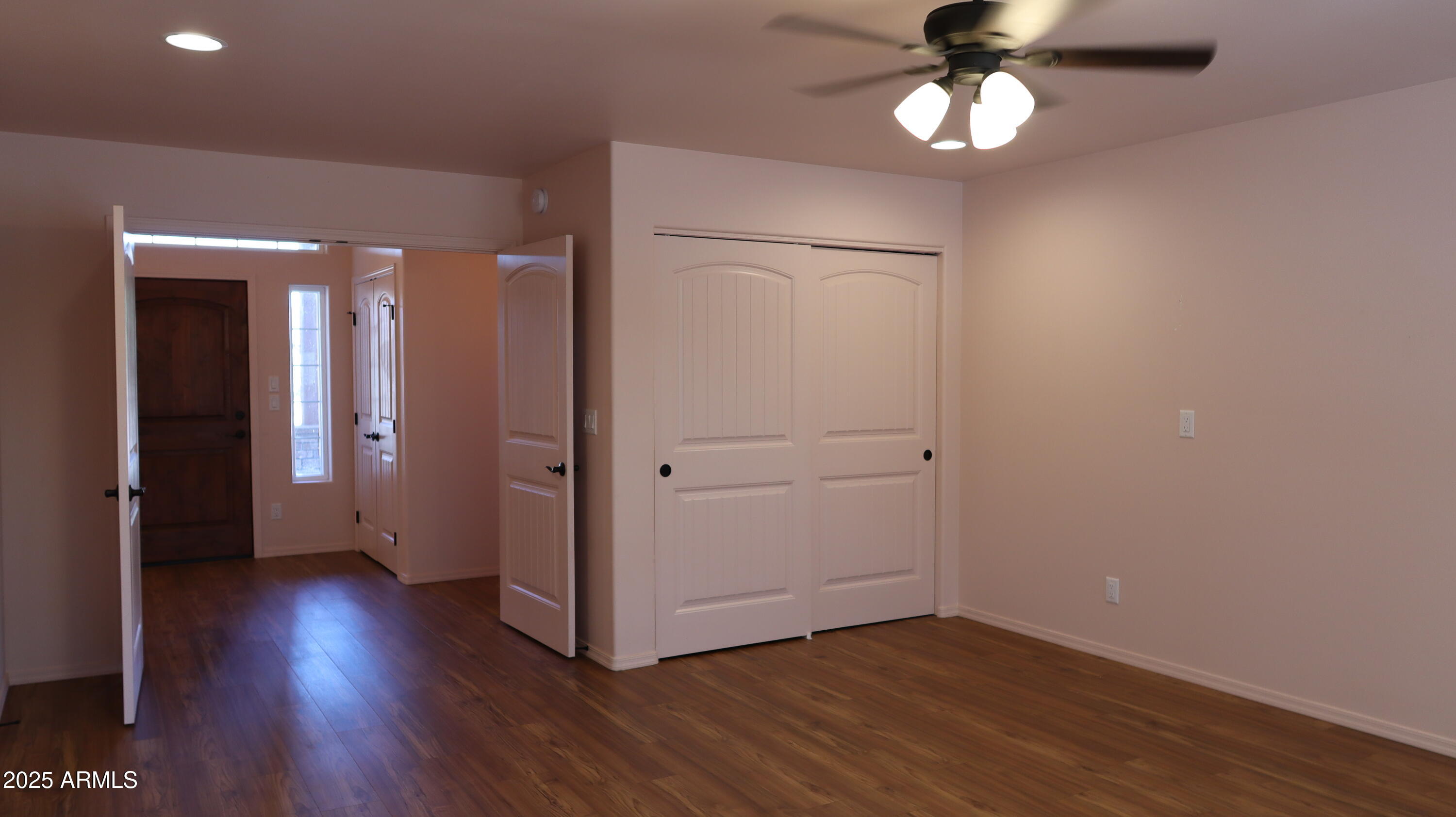 1701 West Dillon Way Payson, AZ 85541 - Photo 31 of 83 an empty room with wooden floor and windows