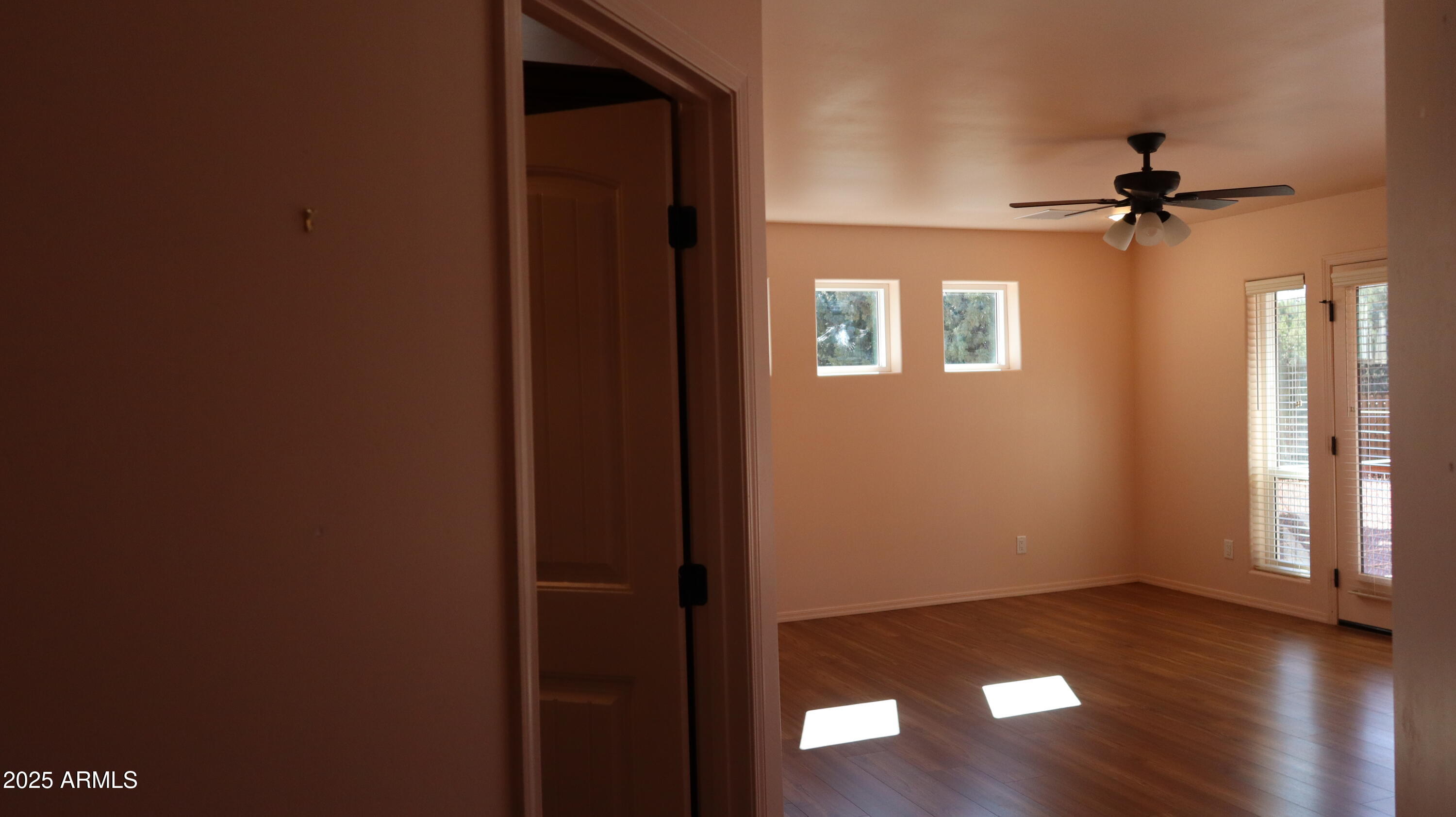 1701 West Dillon Way Payson, AZ 85541 - Photo 35 of 83 an empty room with wooden floor closet and windows
