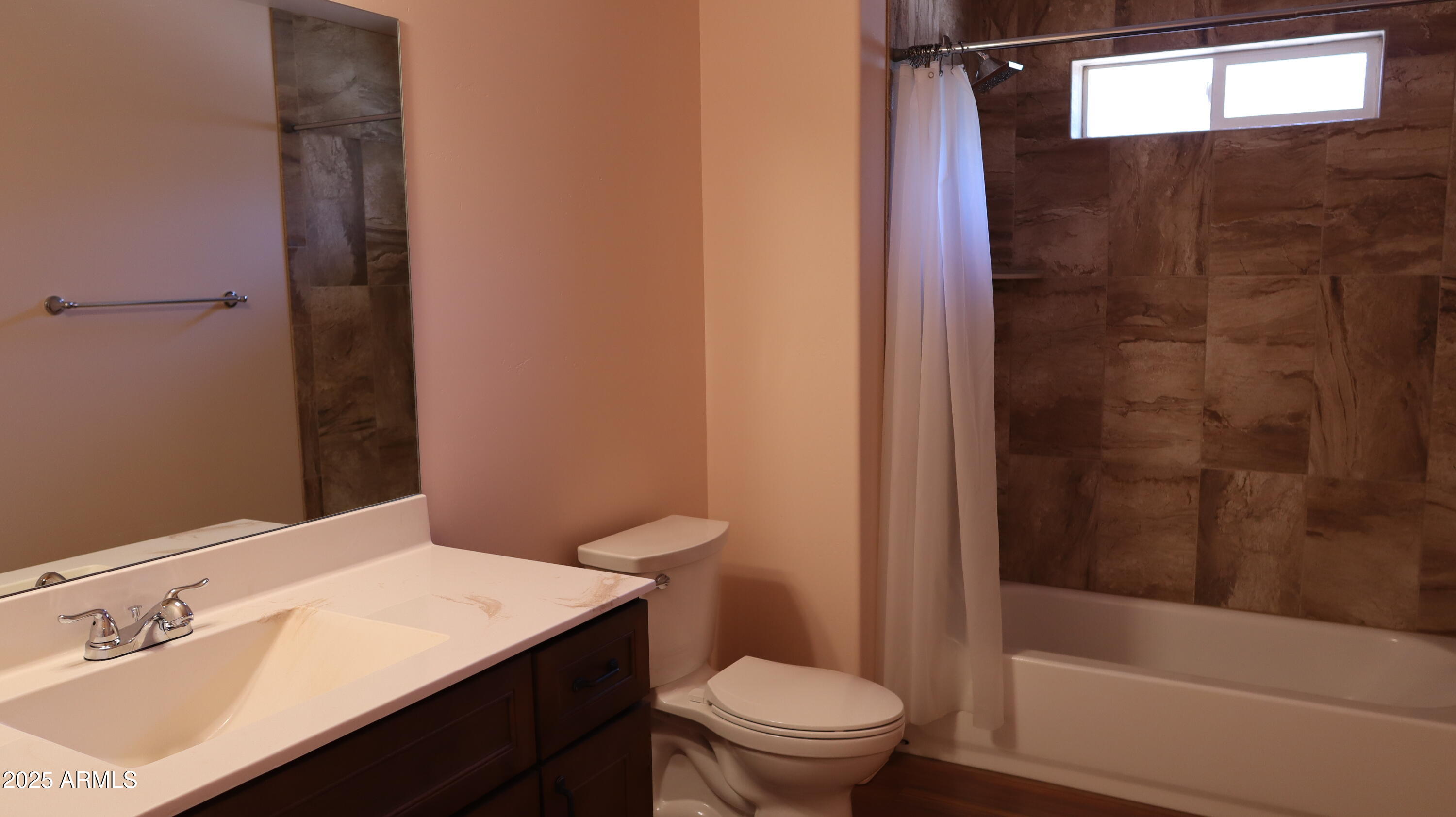 1701 West Dillon Way Payson, AZ 85541 - Photo 44 of 83 a bathroom with a sink a toilet and shower